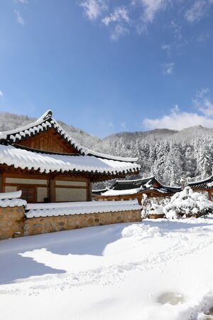 Snowy Korean traditional houses and winter scenery. Woljeongsa buddhist temple, Gangwon-do, Koreaの写真素材