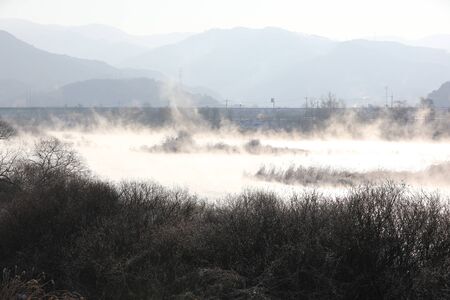 Winter morning landscape of water misty river. Soyang River, Chuncheon City, Koreaの写真素材