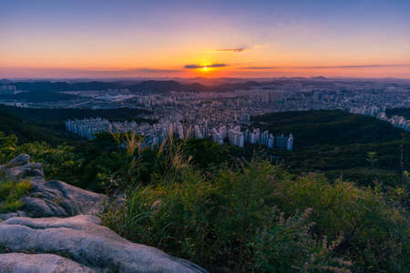 Beautiful sunset in Seoul seen from the top of the mountain. Hoamsan Mountain in Seoul, South Korea.の写真素材
