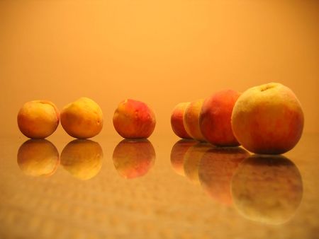 peaches on a glass table