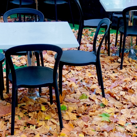 empty chairs at a cafe in cold weatherの写真素材
