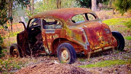 rusty old vintage car in a state  of partial demolisionの写真素材