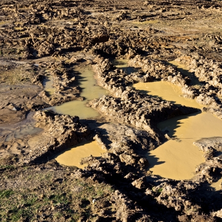 very muddy track left by four wheel drive vehicleの写真素材