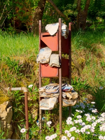 Overflowing derelict mailbox stuffed with advertising material の写真素材