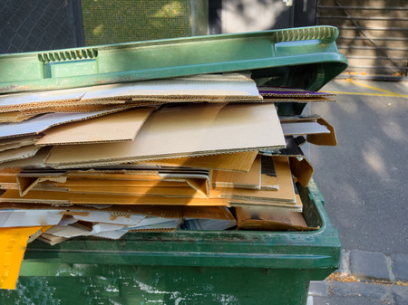 a waste bin full of cardboard ready for recyclingの写真素材