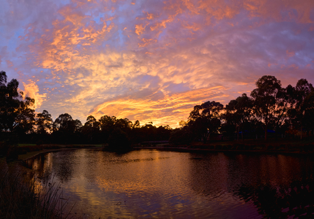beautiful sunrise over a dam in Diamond Creek melbourneの写真素材