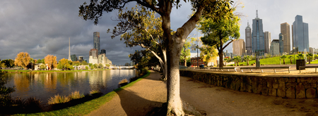 panorama of melbourne on a cloudy autumn day with yarra river split into a north and south viewの写真素材