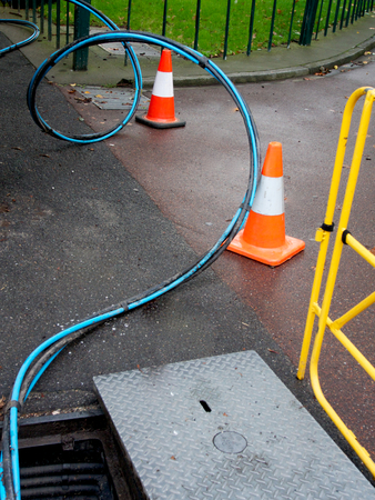 a coil of blue optical fibre cable delivering high speed internetの写真素材