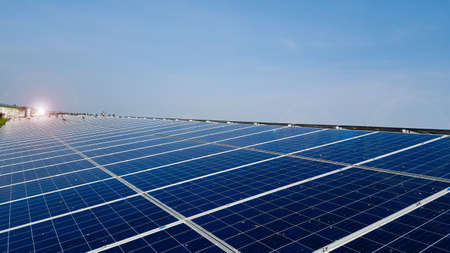 Solar cell panels which are installed on a roof of a building to save power and money become dirty caused by groups of pigeons.の写真素材