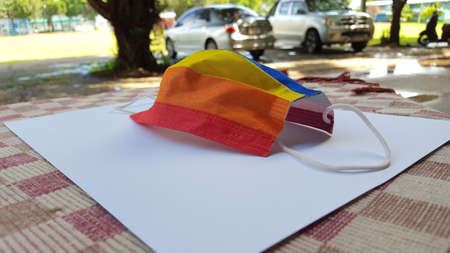 Colorful mask on a white sheet is to protect peopleの写真素材