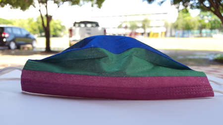 Colors mask on a white sheet is to protect peopleの写真素材