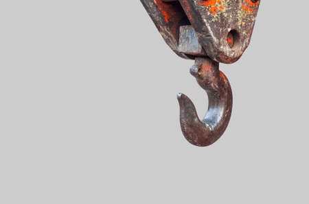 Crane hook at the end of crane arm behind the truckの写真素材