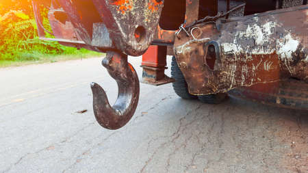 Crane hook at the end of crane arm behind the truckの写真素材