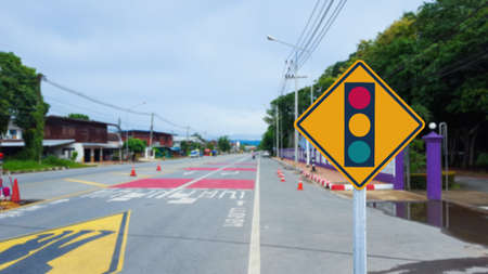Traffic light sign beside roadの写真素材