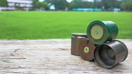 Used copper empty bullet shells on wood plankの写真素材