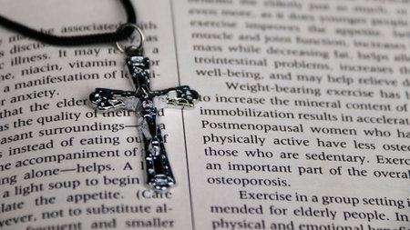 Cross on the Bible. Close-up. Selective focus.の写真素材