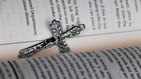 Cross on the bible, close-up, shallow depth of fieldの写真素材