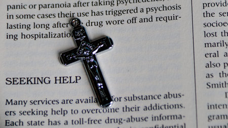 Close up of Christian cross on a bible book. Religion concept.の写真素材