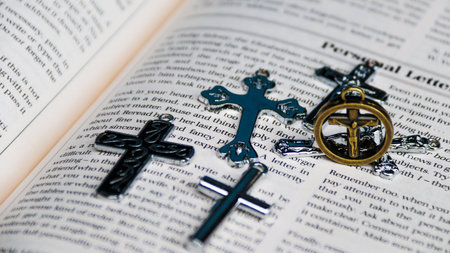 Crosses and bible on a white background, close-up.の写真素材