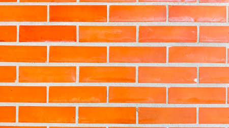 Close up red brick wall texture background to be used as background photoの写真素材