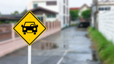 Car shape printed on yellow parking sign in a parking spaceの写真素材