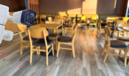 Coffee tables and chairs in the coffee shop under the morning sun light soft and selective focusの写真素材