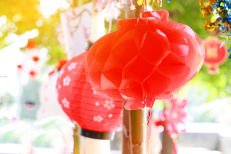 Bright red paper lanterns hanging beautifully as part of Chinese New Year decorations, symbolizing prosperity, good fortune, and happiness.の写真素材
