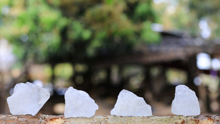 Crystal clear alum cubes or Potassium alum in on rough surface chemical compound substance concept for beauty spa and underarm treatment industrialの写真素材