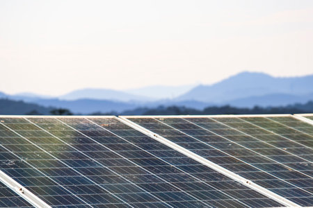 Solar panels with visible dirt and dust mounted on a rooftop. Represents the importance of...