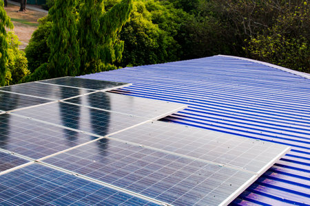 Solar panels with visible dirt and dust mounted on a rooftop. Represents the importance of...