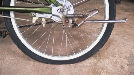 Detailed view of a deflated bicycle tire, symbolizing travel challenges, maintenance, and everyday...