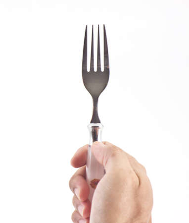 Fork in right hand isolated on white backgroundの写真素材