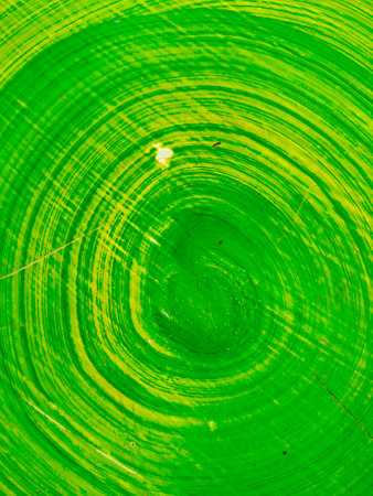 The surface of the table is made of cement. painted green and yellow Taken in the afternoon of one working day.の写真素材