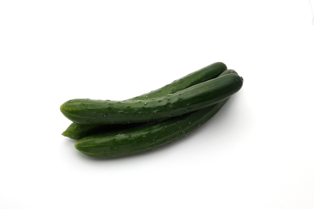 Fresh japanese cucumbers on white background,の写真素材