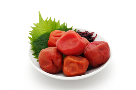 Japanese salt plum or pickled plum on white backgroundの写真素材
