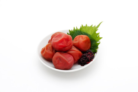 Japanese salt plum or pickled plum on white backgroundの写真素材