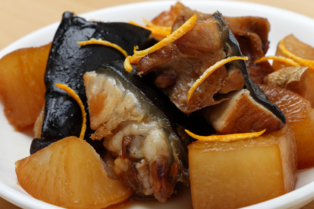 Japanese food Simmered Yellowtail with Radish, radish soy sauce simmered