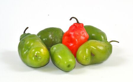 colorful hot chilli pepper on white background - raw food ingredient conceptの写真素材