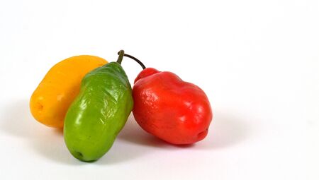colorful hot chilli pepper on white background - raw food ingredient conceptの写真素材