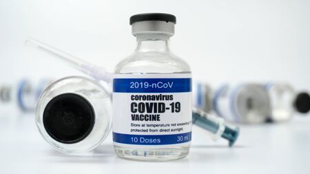 Covid-19 Corona Virus 2019-ncov vaccine vials medicine drug bottles syringe injection. Vaccination, immunization, treatment to cure Covid 19 Corona Virus infection. Healthcare And Medical concept.の写真素材