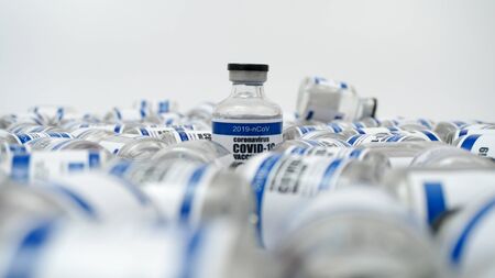 COVID-19 Corona Virus 2019-ncov Vaccine injection vials medicine drug bottles. Vaccination, immunization, testing, treatment to cure Covid-19 Corona Virus infection. Healthcare And Medical concept.の写真素材