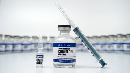 Covid-19 Corona Virus 2019-ncov vaccine vials medicine drug bottles syringe injection. Vaccination, immunization, treatment to cure Covid 19 Corona Virus infection. Healthcare And Medical concept.の写真素材