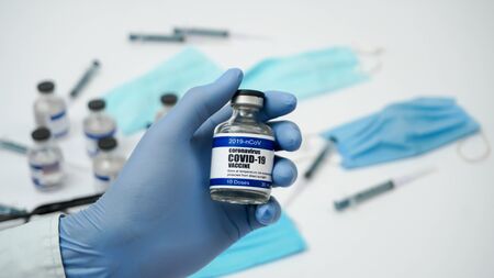 Covid-19 Corona Virus 2019-ncov Vaccine vials medicine drug ampoule bottle closeup syringe injection...