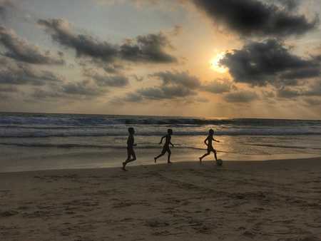 boys playing at beachの素材
