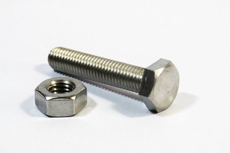 Metal bolt and nut isolated on white background