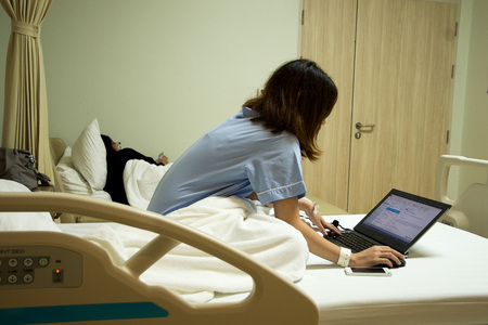 sick person runs urgently on a nursing bed.の写真素材