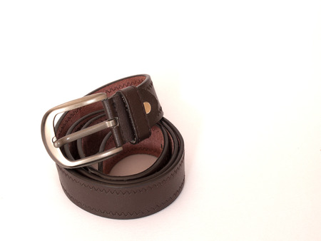 Brown leather belt on white backgroundの写真素材