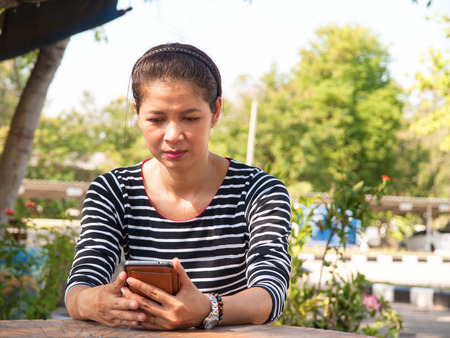 Women with using the phone to communicate.の写真素材