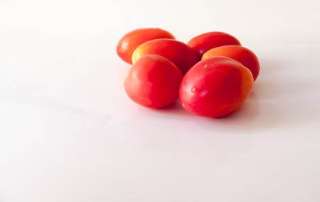 Tomato red on a white background.の写真素材