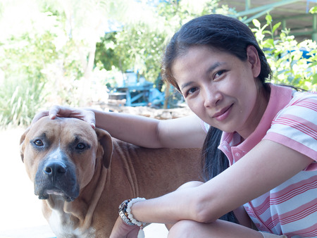 Women Against Pitbull dog.の写真素材